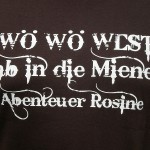 Aktions T-Shirt in braun mit dem weißen Schriftzug Wö Wö West - ab in die Miene - Abenteuer Rosine